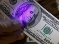 Житель Якутска нашел и обменял поддельные доллары на рубли